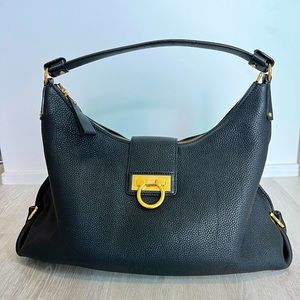 Salvatore Ferragamo black leather hobo bag with golden buckle, authentic